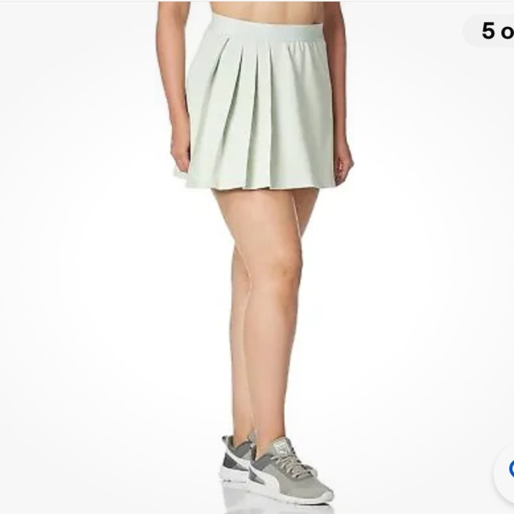Puma classics asymmetric golf/sport skirt. NWT. Retail 40